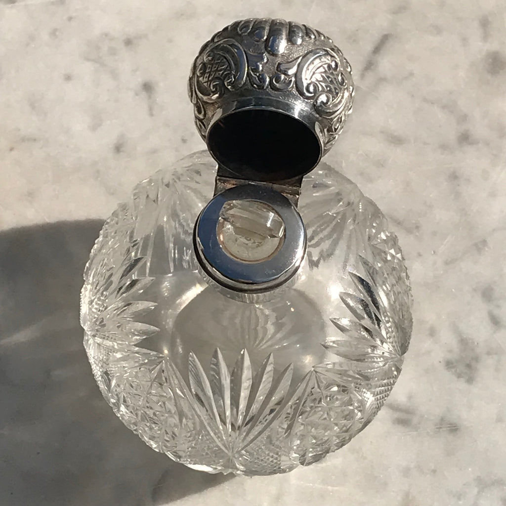 A Pair of Antique Silver Topped Scent Bottles