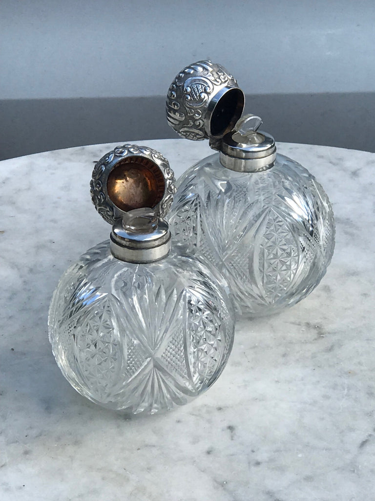 A Pair of Antique Silver Topped Scent Bottles