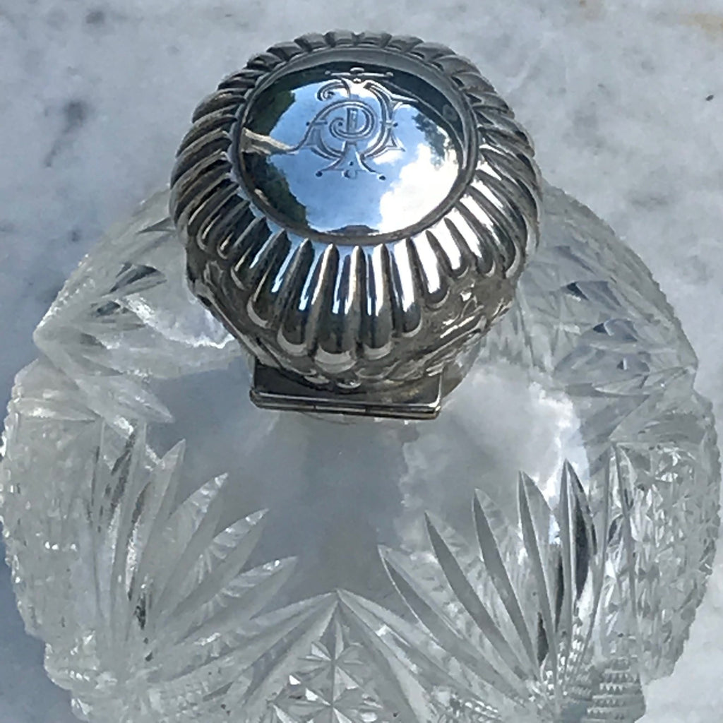 A Pair of Antique Silver Topped Scent Bottles