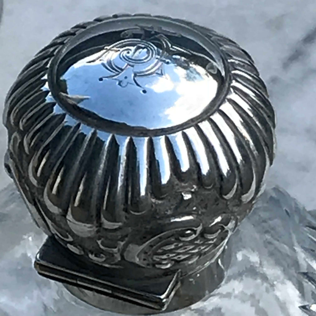 A Pair of Antique Silver Topped Scent Bottles