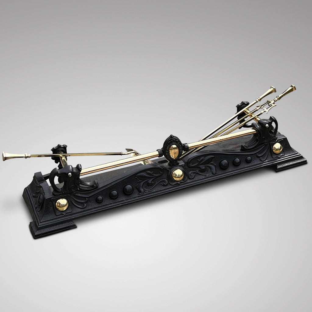 Aesthetic Period Cast Iron Fender with Brass Fire Irons - Main View - 1