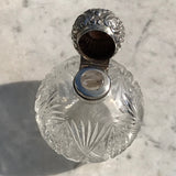 A Pair of Antique Silver Topped Scent Bottles