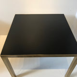 A Pair of Mid Century Black Topped Brass Side Tables